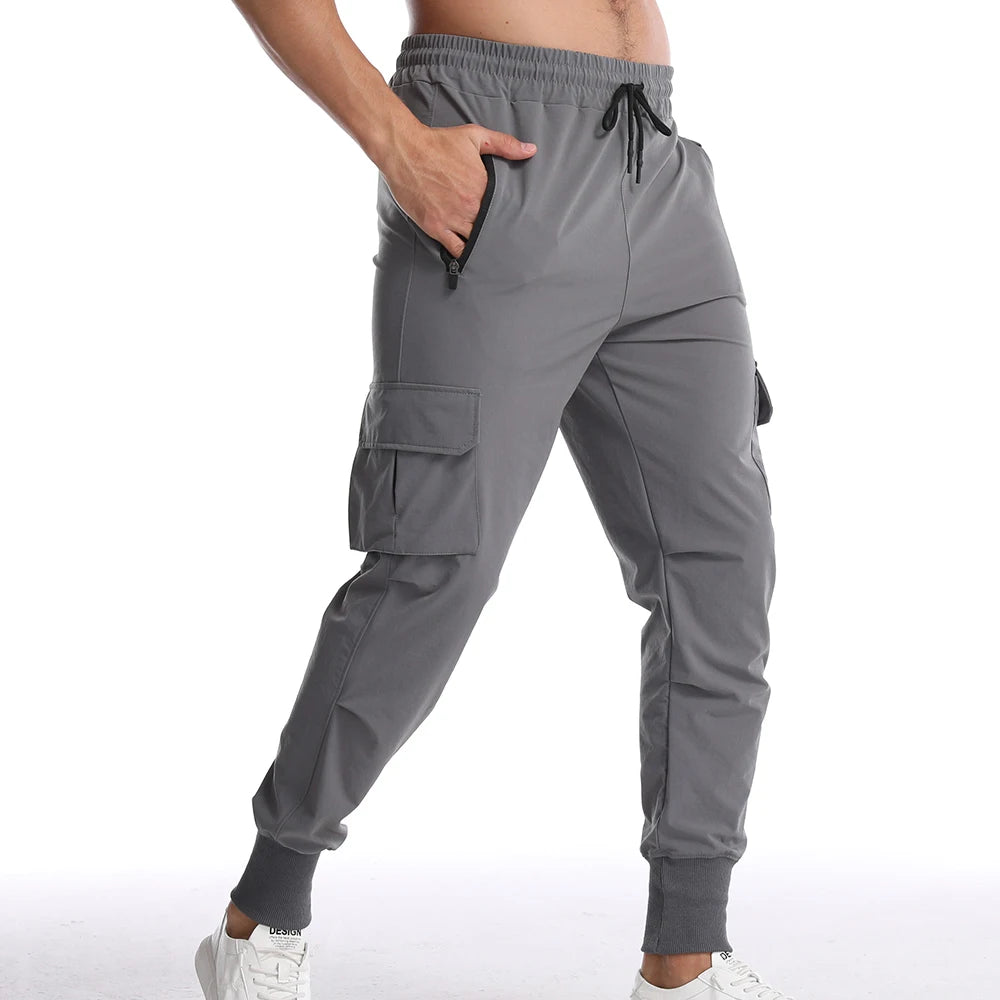 Men's sports pants in cargo style, gray, featuring a drawstring closure and comfortable pockets.
