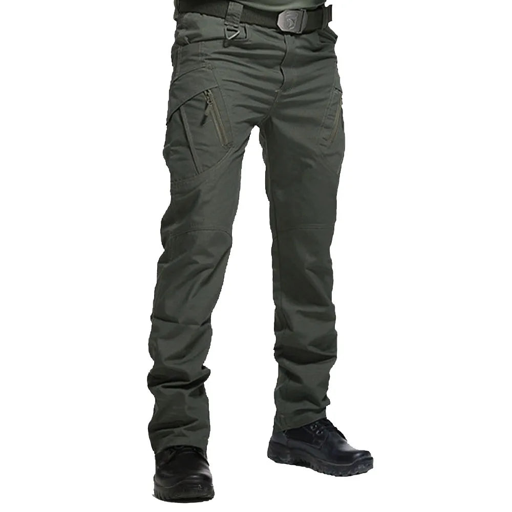 Green tactical pants with multiple pockets on a white background