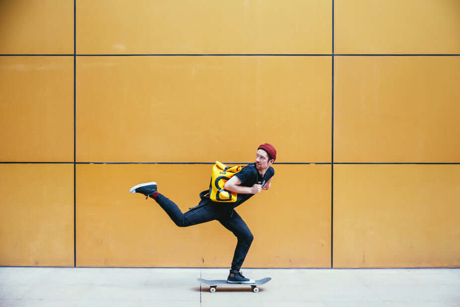 skateboarder-rides-past