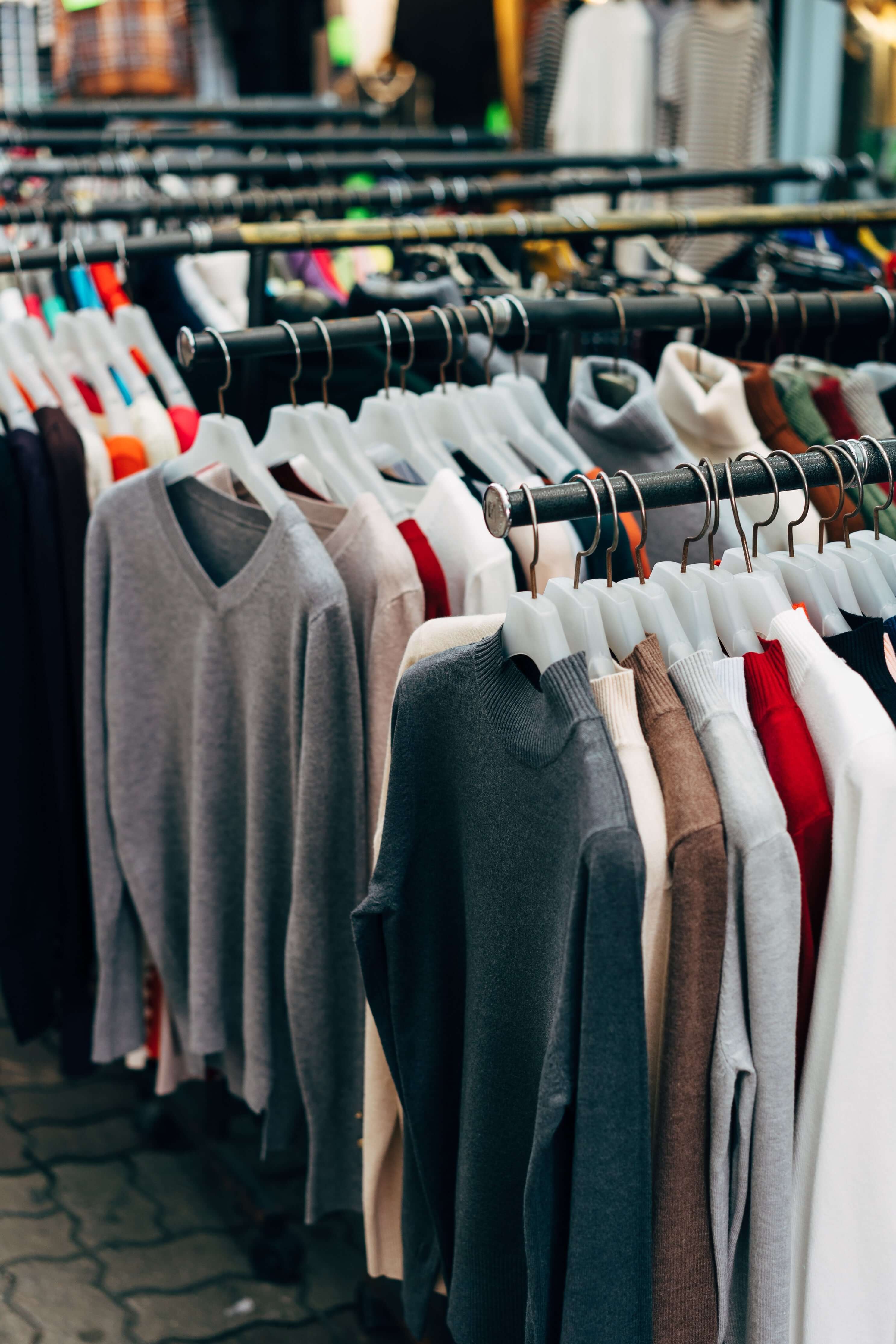 clothes-on-a-rack-in-a-clothing-store - Fashion NetClub