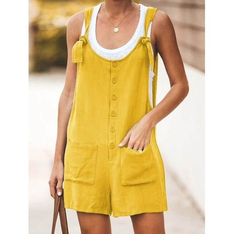 A happy woman dressing a jumpsuit yellow color