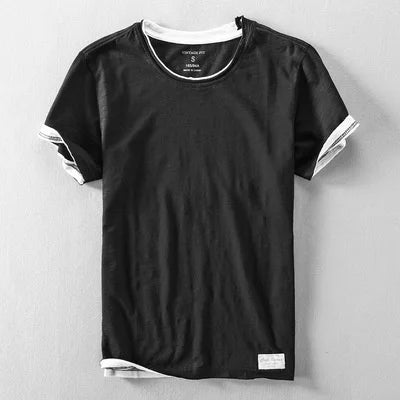 Black t-shirt with white accents on a gray background