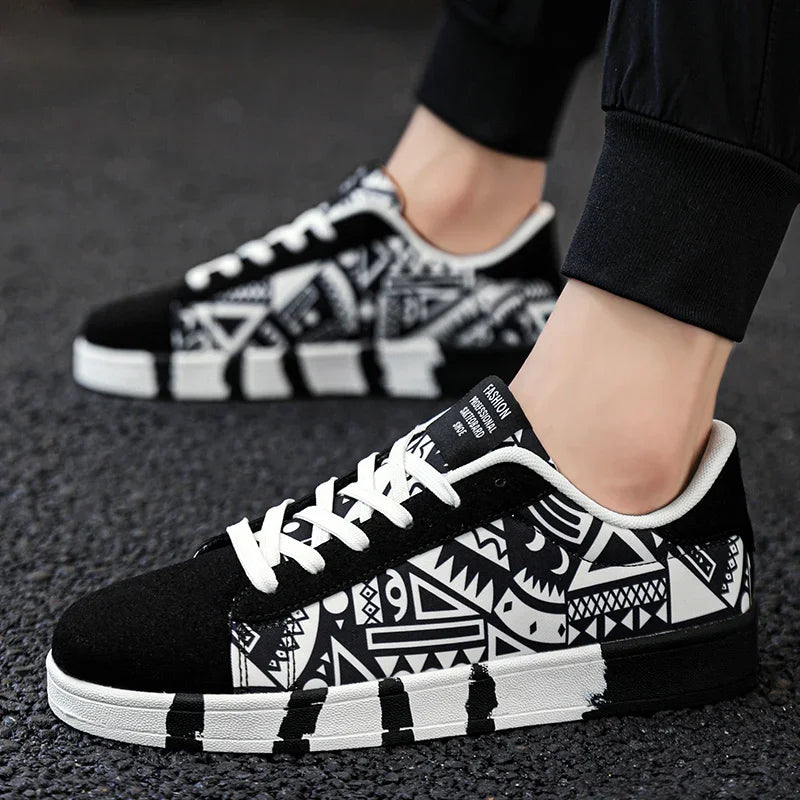 Black and white patterned sneakers worn on a dark surface