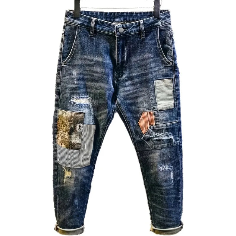 Blue jeans with patchwork design on a white background