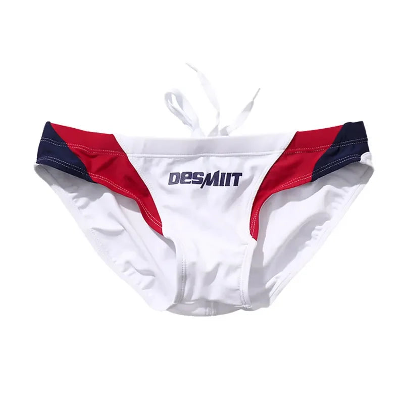 White swim briefs with red and blue accents on a white background, featuring the Desmiit brand.