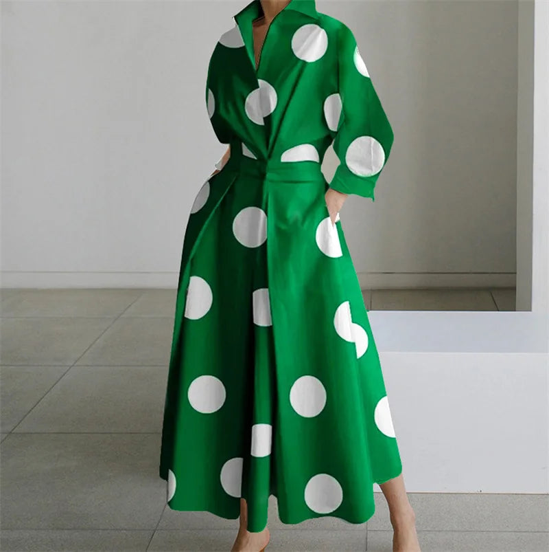 Green dress with white polka dots worn by a person indoors.