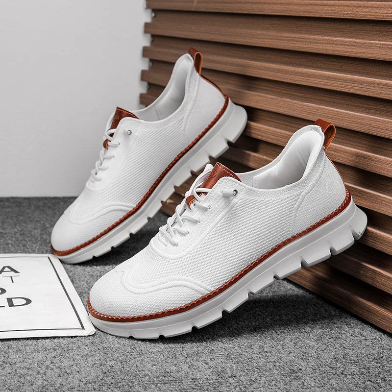 White sneakers with brown accents on a gray surface with wooden slats in the background