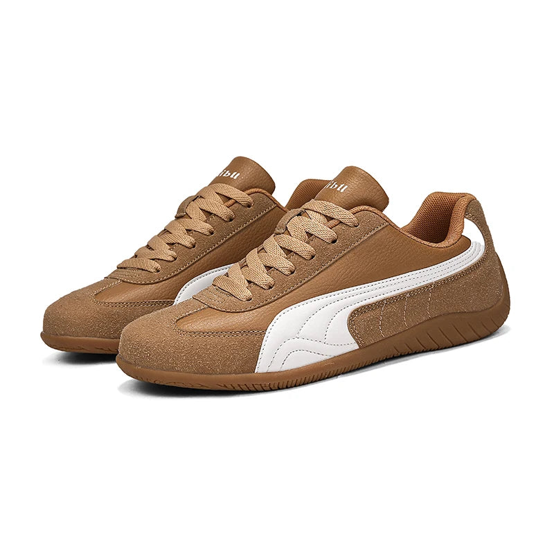 Pair of brown sneakers with a white logo on a white background