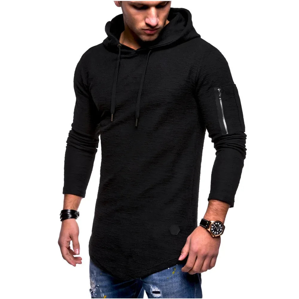 Man wearing a black hoodie with a white background