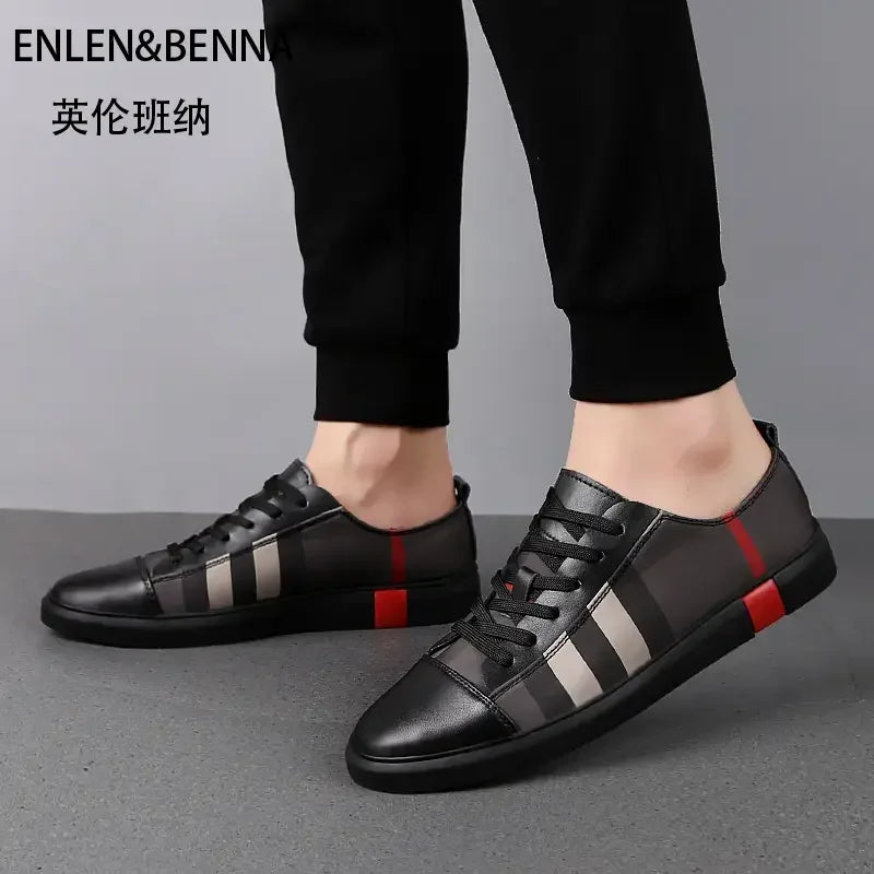 Black sneakers with red and gray stripes worn by a person on a gray background, featuring the brand 'ENLEN&BENNA'.
