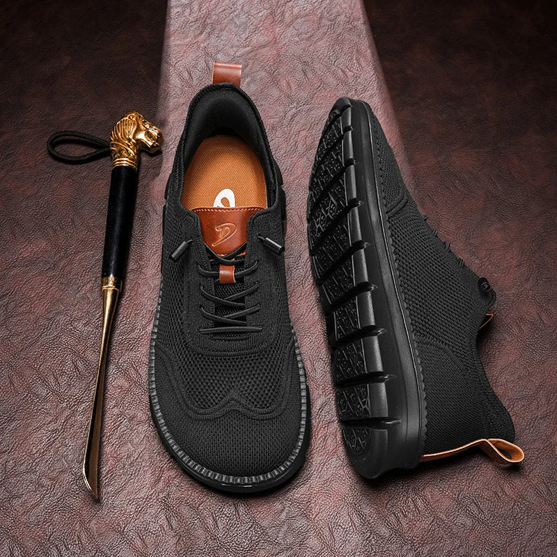 Black sneakers with brown accents on a textured surface